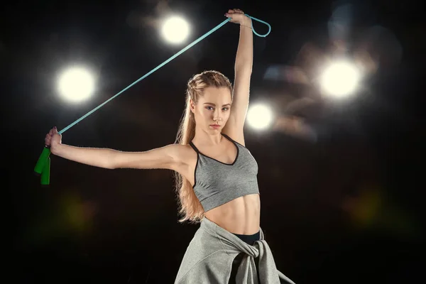 Woman holding skipping rope — Stock Photo