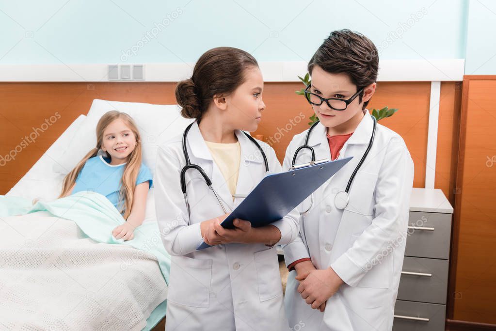 Kids playing doctors and patient 