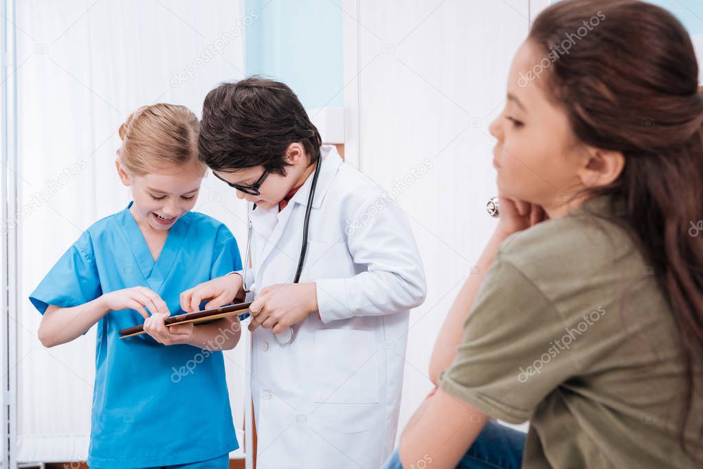 kids playing doctor and patient 