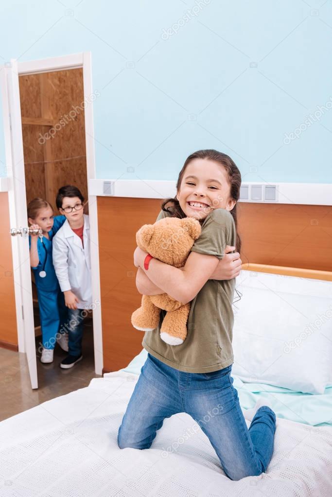 kids playing doctor and patient 