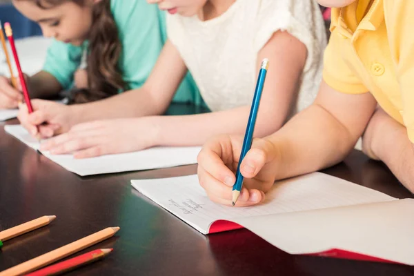 Schoolchildren studying together — Stock Photo, Image