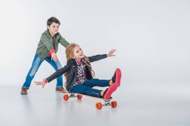 Boy and girl with skateboard clipart