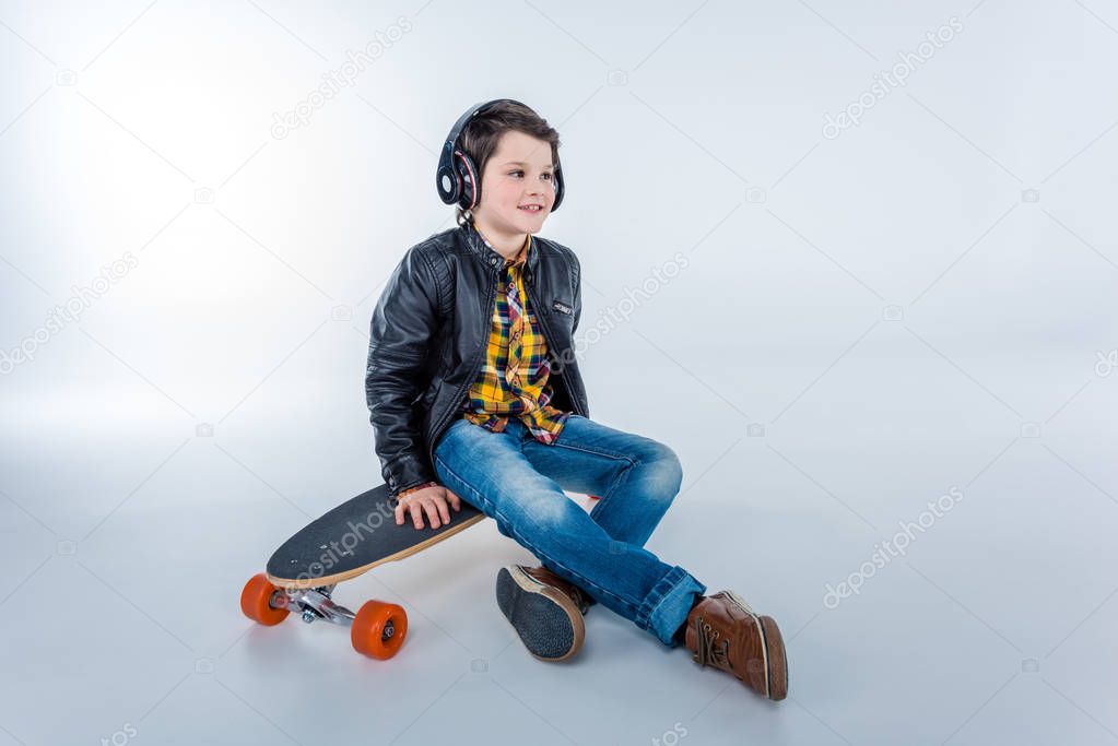 Boy in headphones with skateboard