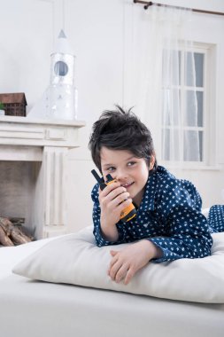 Boy using walkie-talkie  clipart