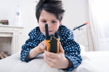 Boy using walkie-talkie  clipart