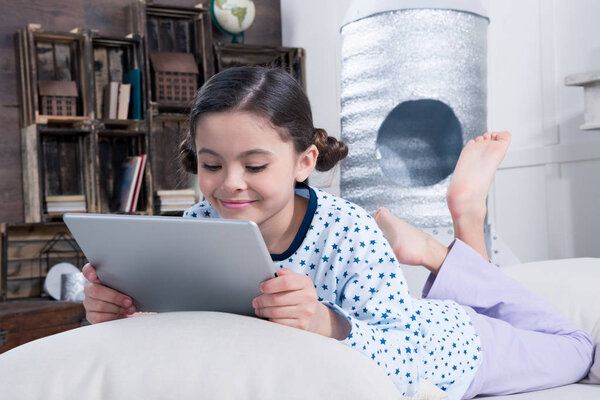 Girl using digital tablet 