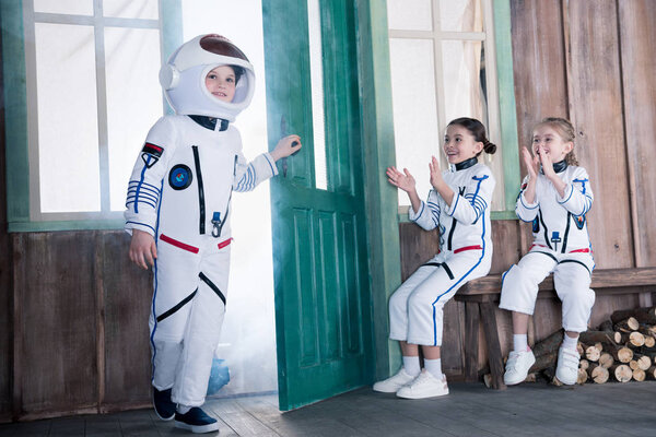 children in astronaut costumes   