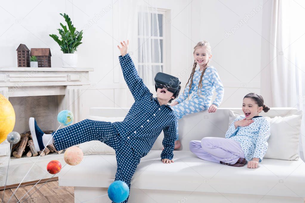 kids playing with virtual reality headset