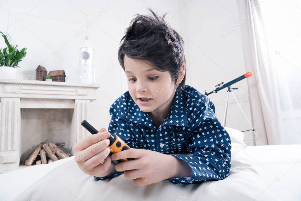 Boy using walkie-talkie 