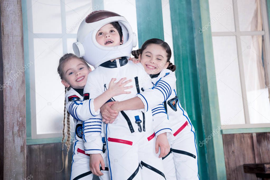children in astronaut costumes   