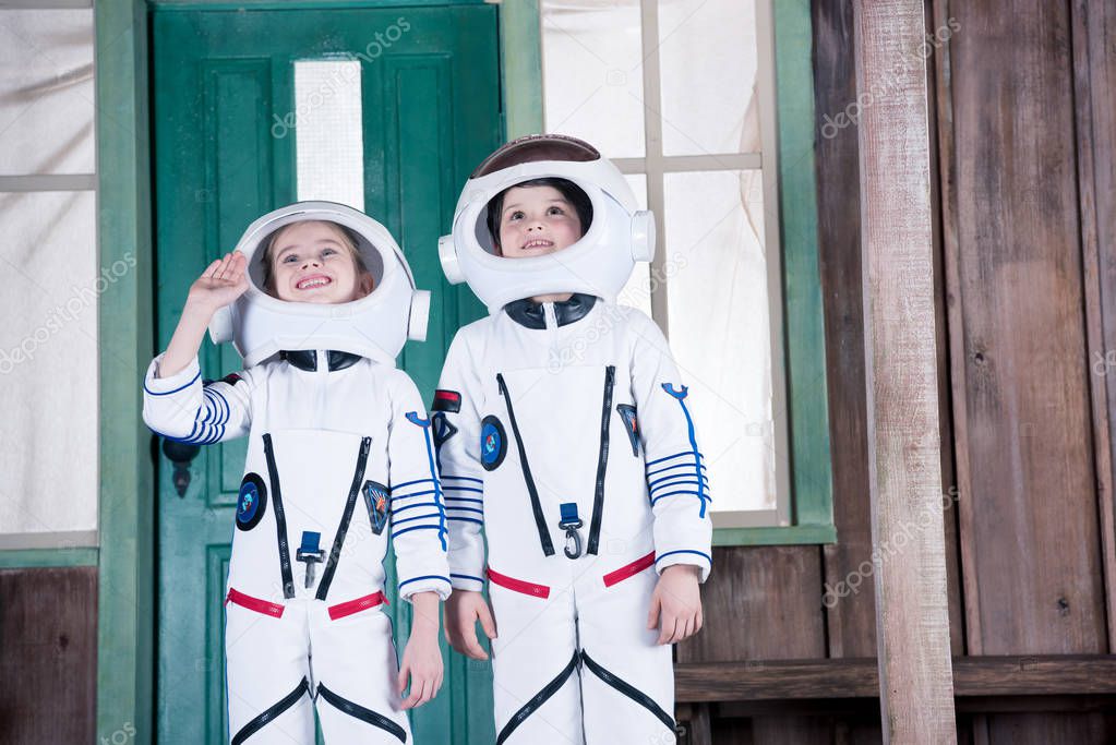 children in astronaut costumes   