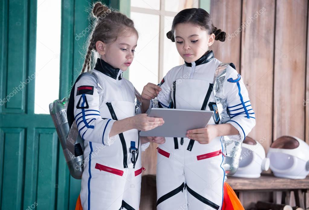girls in astronaut costumes
