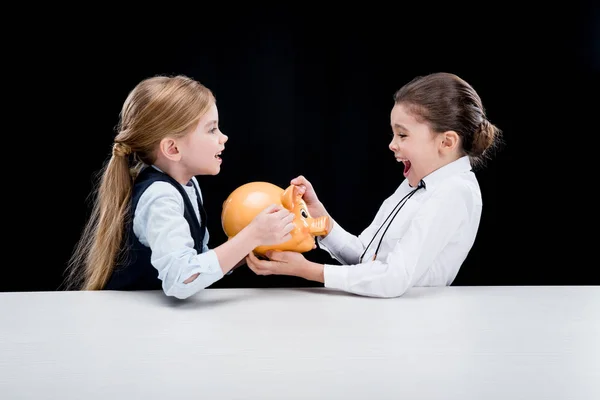 Girls with piggy bank — Stock Photo, Image