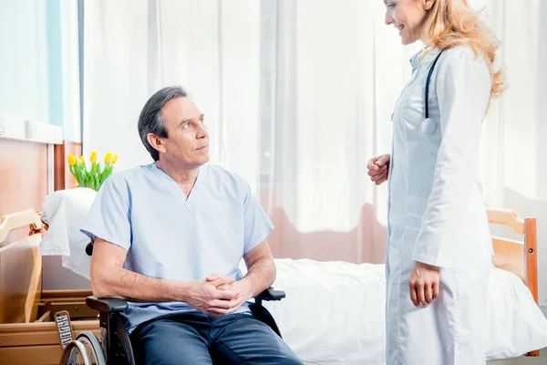 Elderly man sitting in wheelchair — Stock Photo, Image