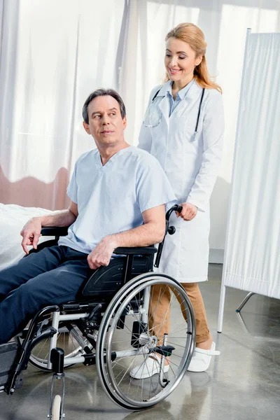 Elderly man sitting in wheelchair — Stock Photo, Image