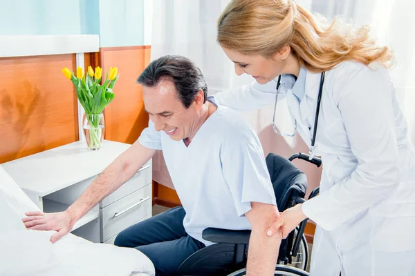 Elderly man sitting in wheelchair — Stock Photo, Image