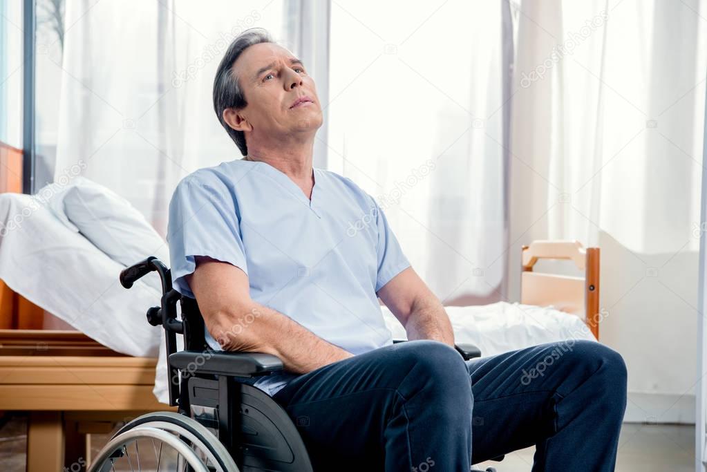 elderly man sitting in wheelchair