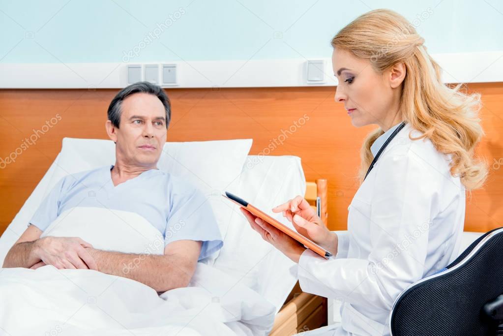 patient and doctor with digital tablet