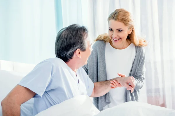 Woman helping husband stand up — Stock Photo, Image