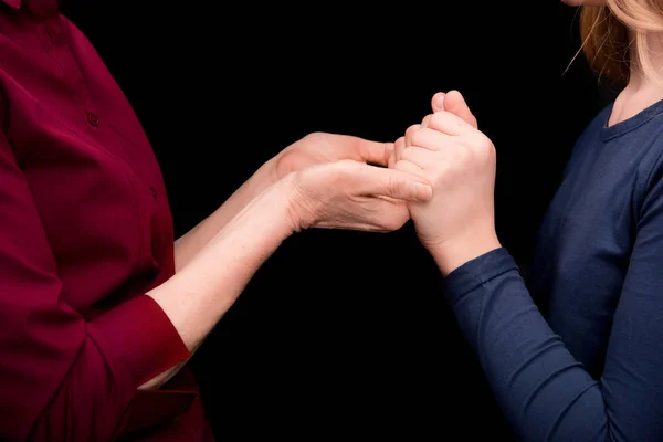 Nieto y abuela tomados de la mano — Foto de Stock