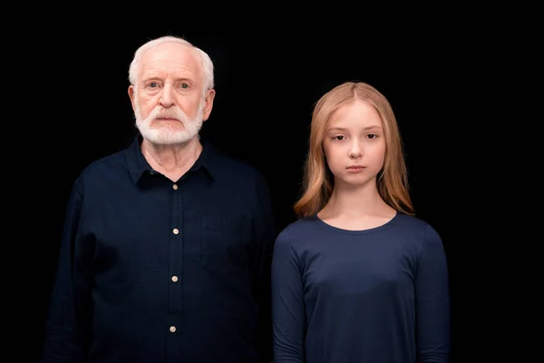 Serious grandfather and granddaughter — Stock Photo, Image