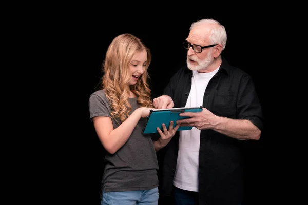 Grandfather and granddaughter with digital tablet — Stock Photo, Image