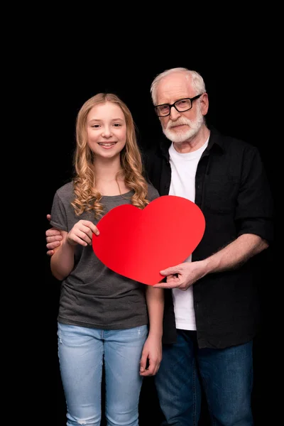 Grandfather and granddaughter with heart symbol — Stock Photo, Image