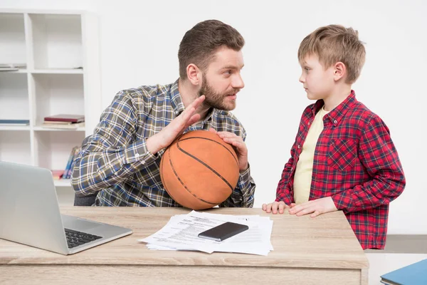 Businessman with son at home office — Stock Photo, Image