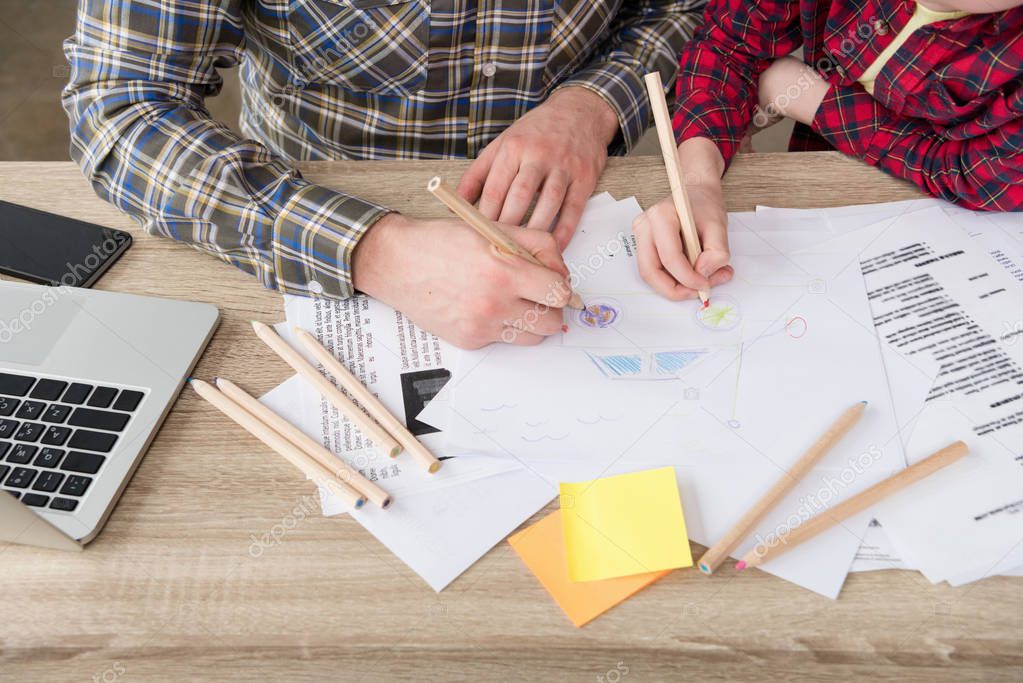 Businessman drawing with son