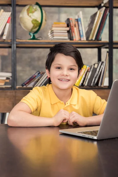 Boy using laptop — Stock Photo