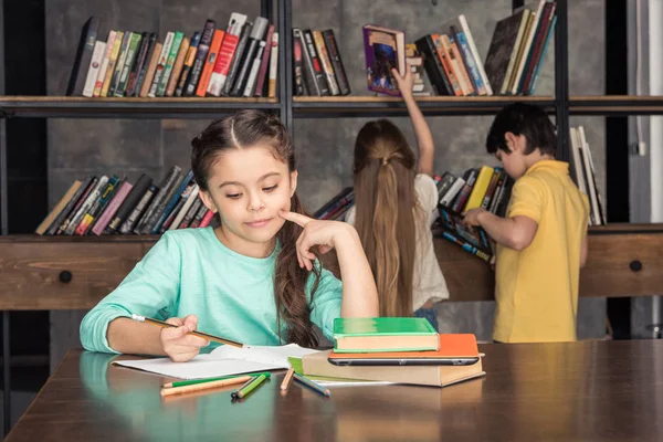 Girl doing homework — Stock Photo