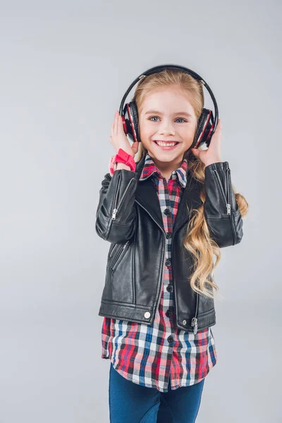 Little girl in headphones — Stock Photo