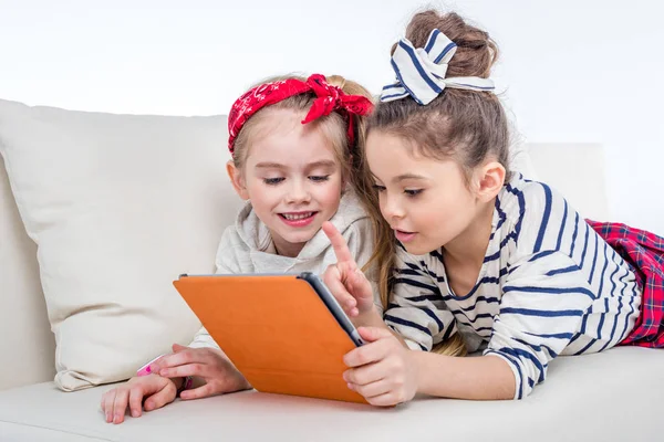 Girls using tablet — Stock Photo