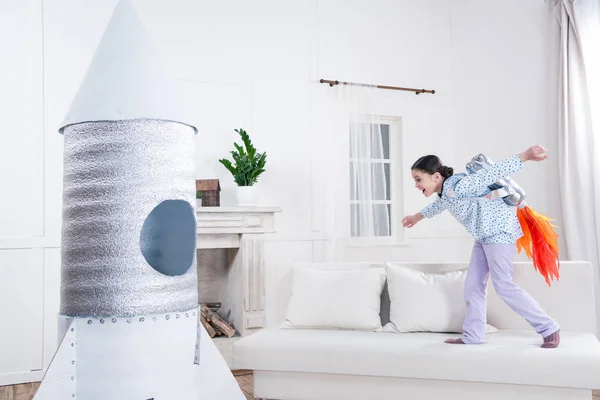 Girl playing cosmonaut — Stock Photo