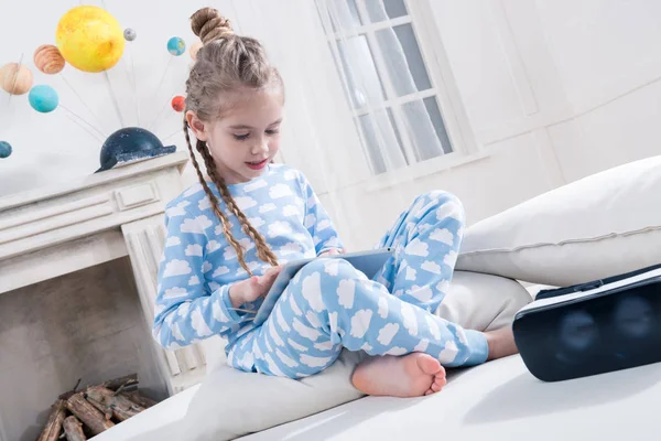 Girl using digital tablet — Stock Photo