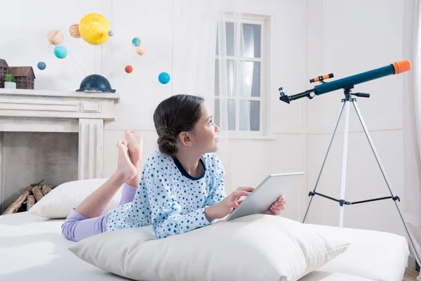 Girl using digital tablet — Stock Photo