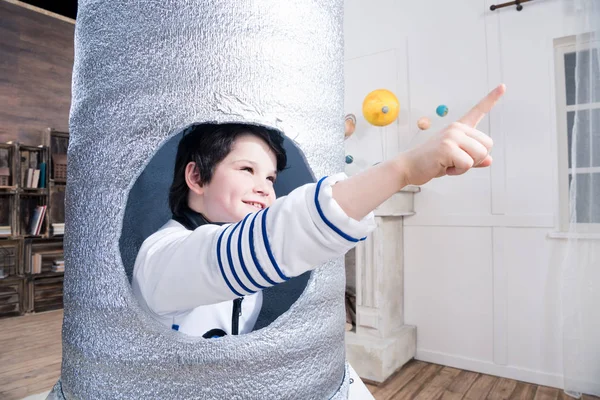 Boy in toy rocket — Stock Photo