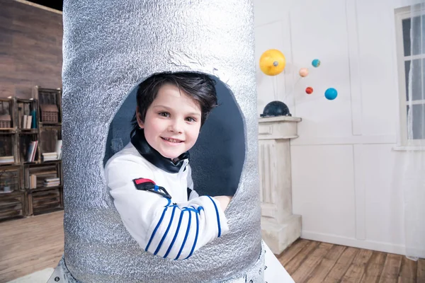 Boy in toy rocket — Stock Photo