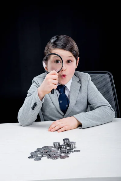 Boy with magnifying glass — Stock Photo