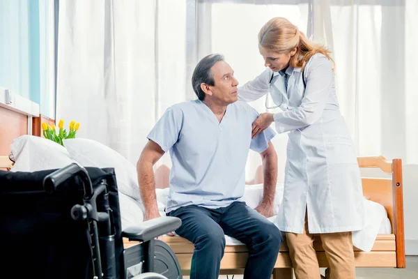 Middle aged patient and doctor — Stock Photo