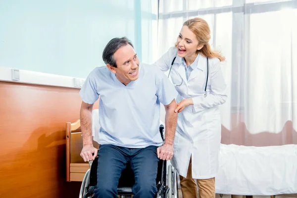 Elderly man sitting in wheelchair — Stock Photo