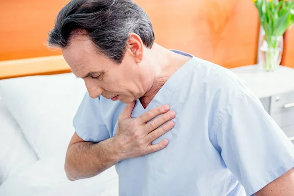 Patient with chest pain — Stock Photo