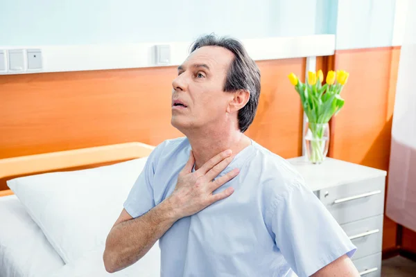 Patient with chest pain — Stock Photo