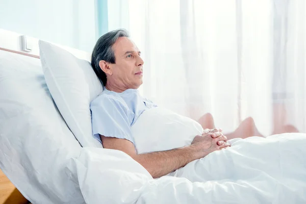 Middle aged patient lying — Stock Photo