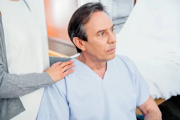 Elderly wheelchair man in hospital — Stock Photo