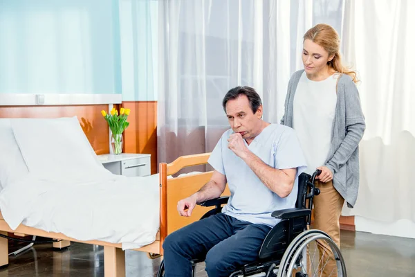 Elderly wheelchair man in hospital — Stock Photo