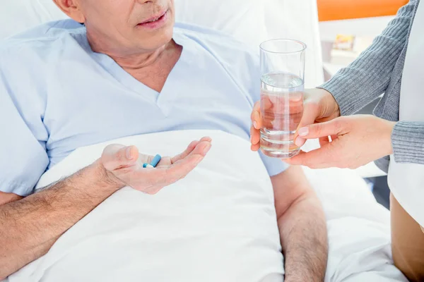 Man taking medicines — Stock Photo