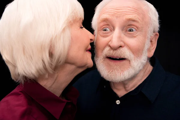 Senior woman kissing man — Stock Photo