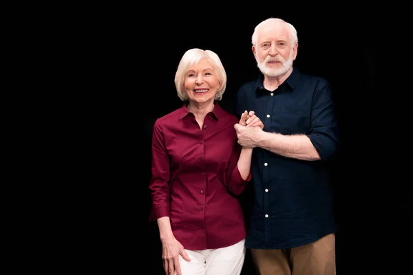 Senior couple holding hands — Stock Photo