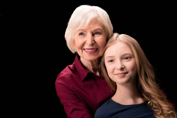 Grandchild and grandmother hugging — Stock Photo